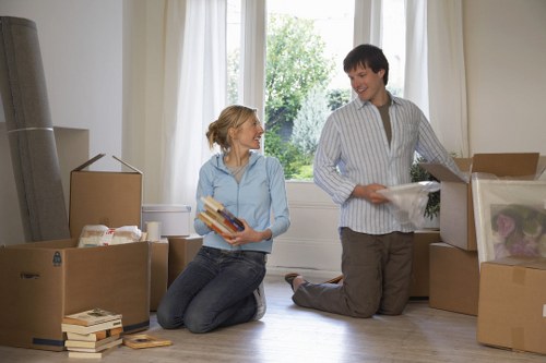 Packed moving boxes and furniture prepared by Belsizepark removalists